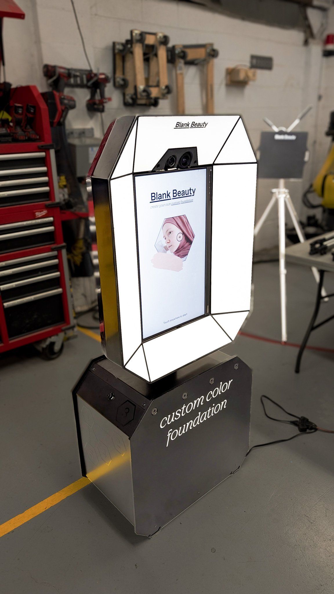 The lit Vivi scanning station, where customers have their face scanned