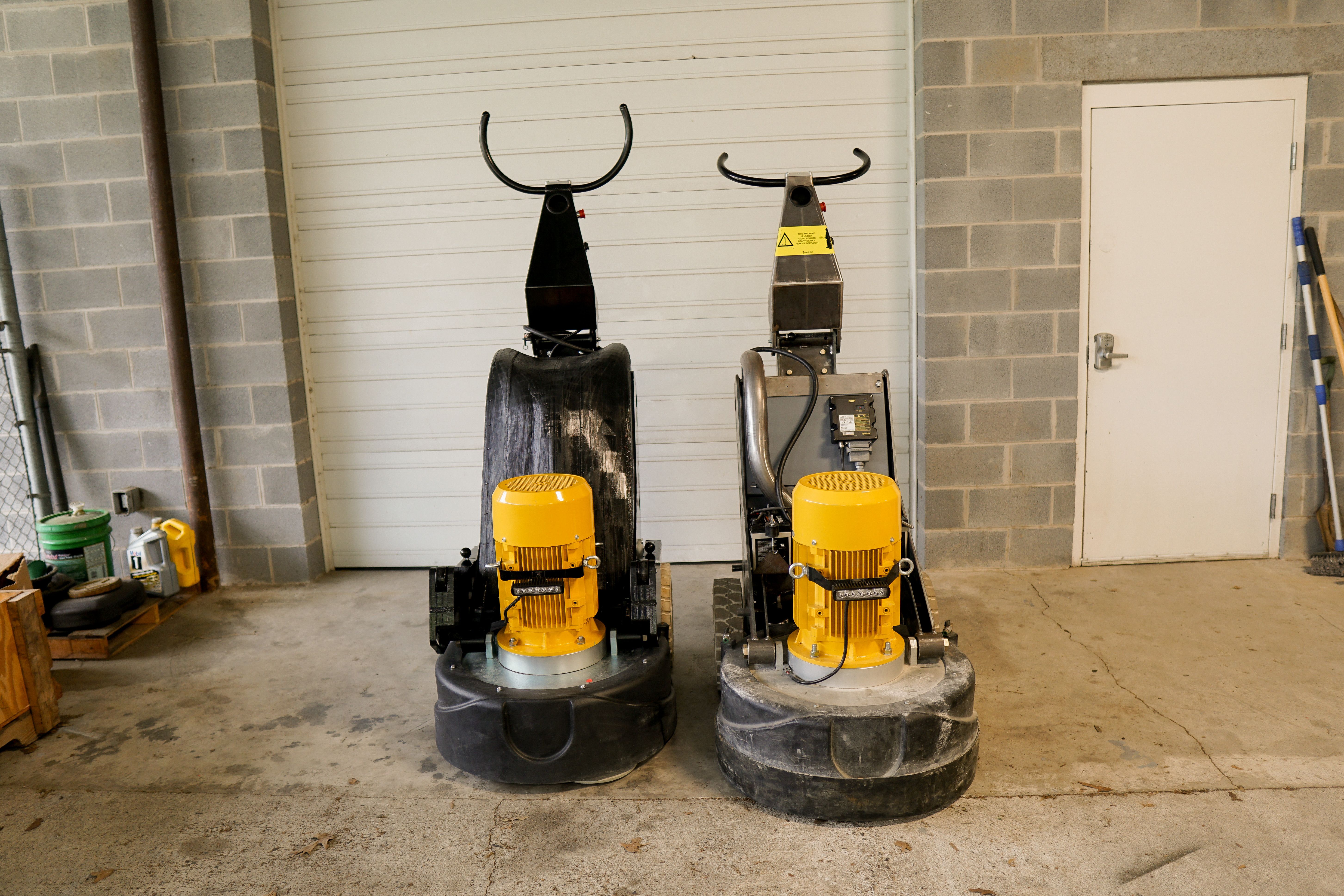 The 8KR grinder prototype with revamped design language (left) next to a SASE grinder with the previous generation's design language (right)