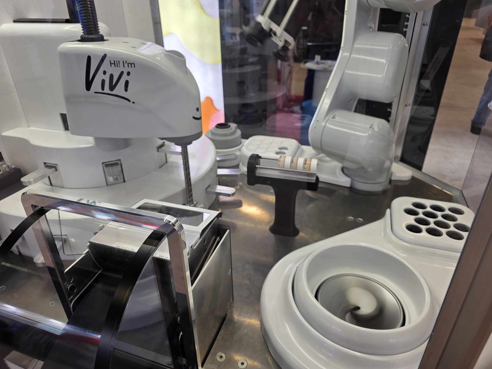 The Vivi mixing bowl and dispensing head seen close up at the booth