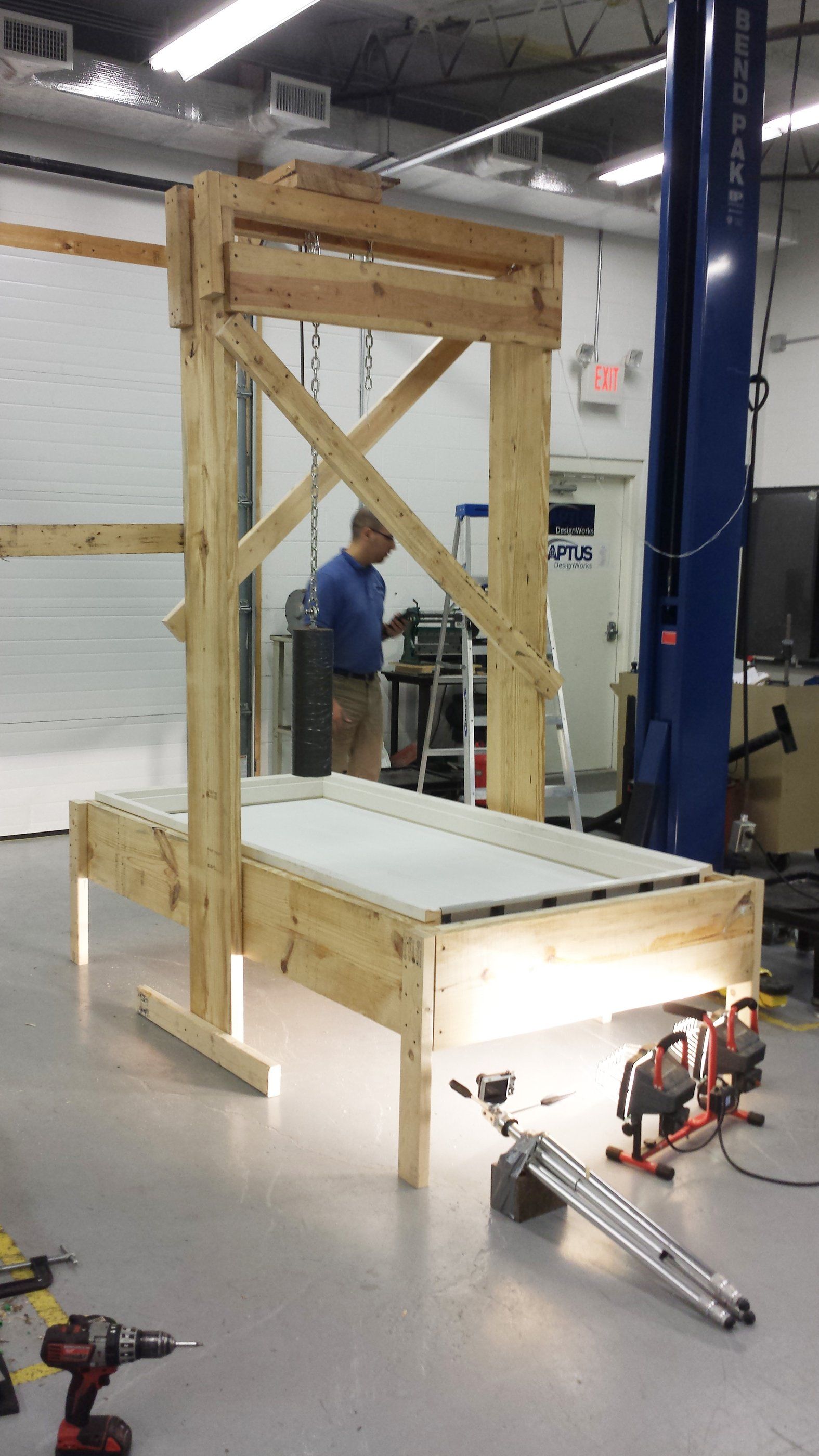 A wooden test rig built in the APTUS shop to load-test the lock