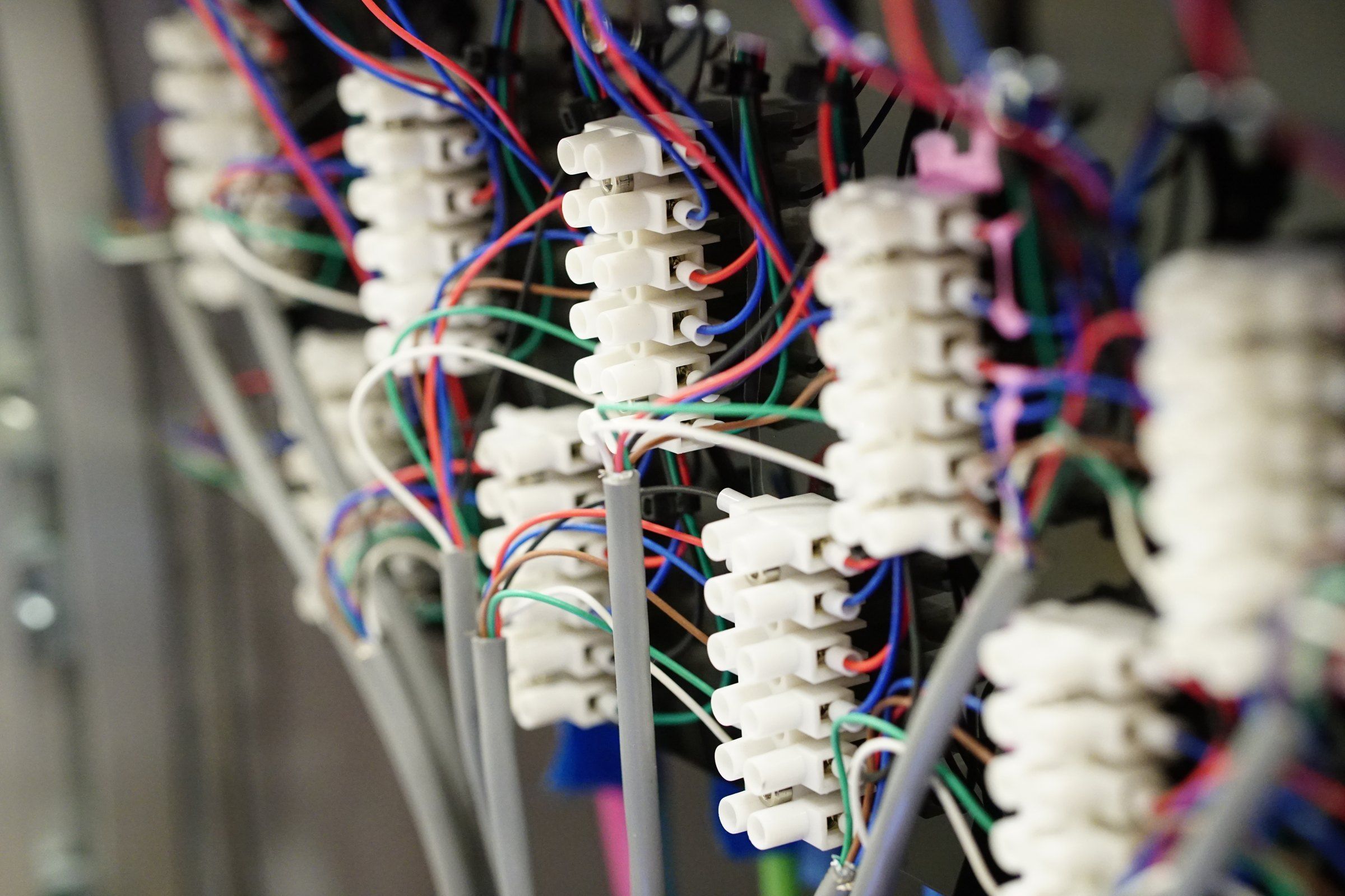 Neatly wired terminal blocks inside a production control panel