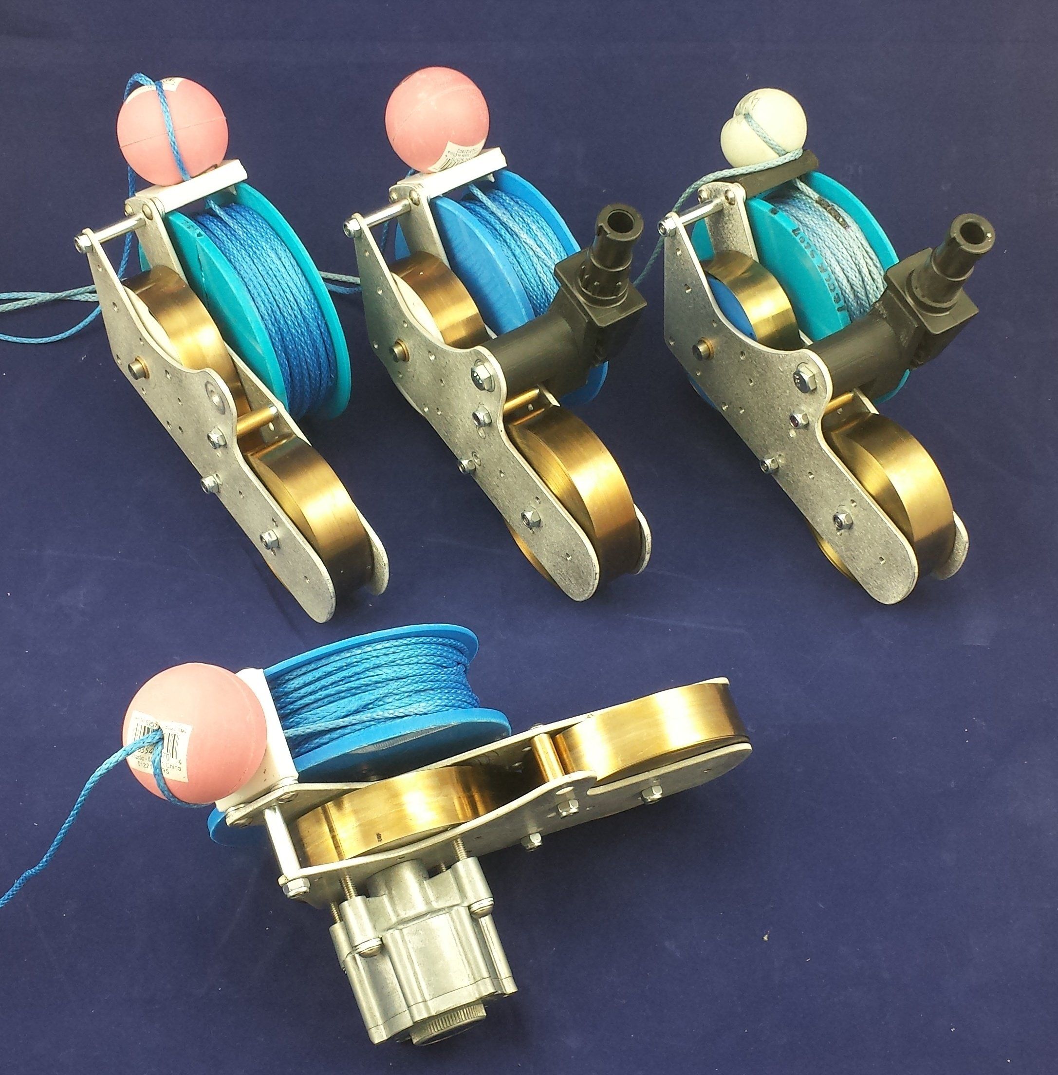 Early working prototypes of the reel, with blue line and floats
