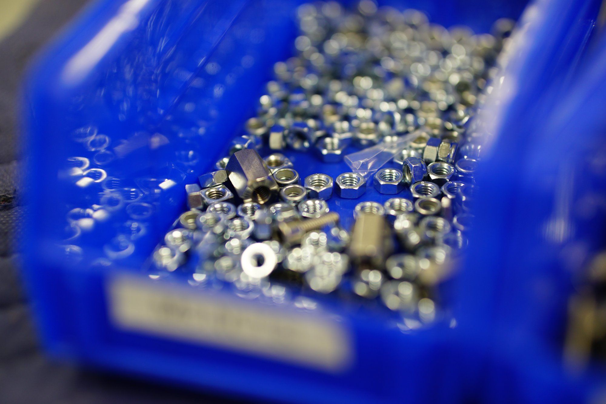 A bin of sorted hardware ready for assembly